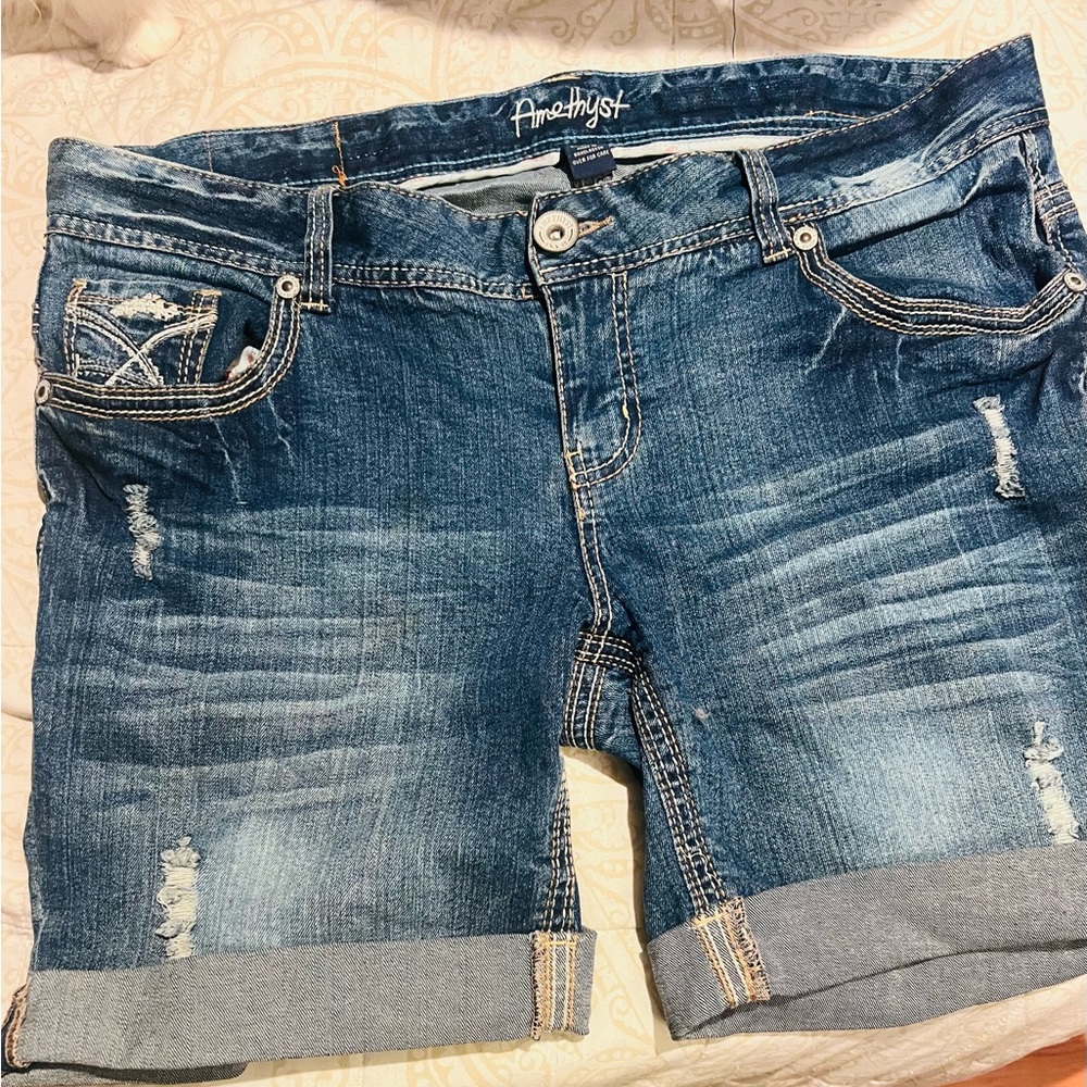 Amethyst brand distressed looking blue jean shorts. Stretchy.